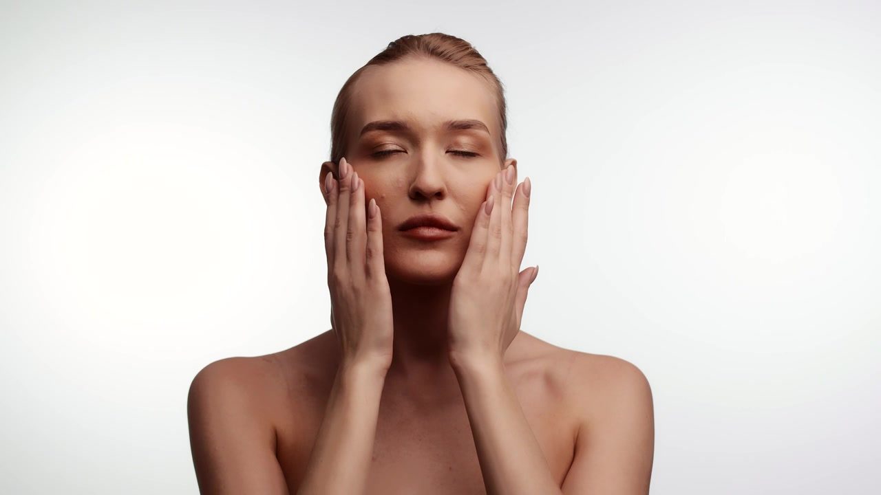 Woman applying face cream